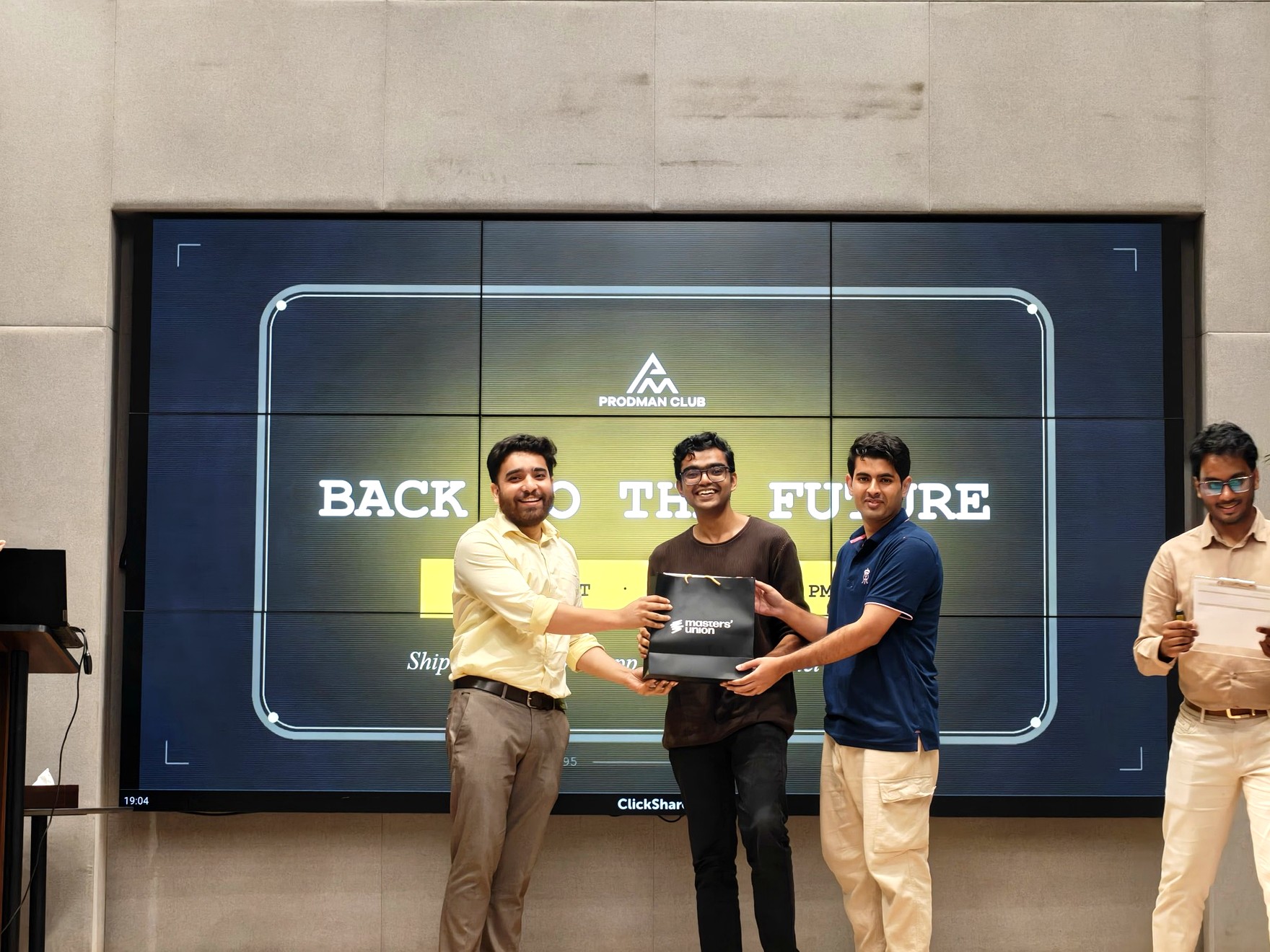 A team receiving recognition on stage