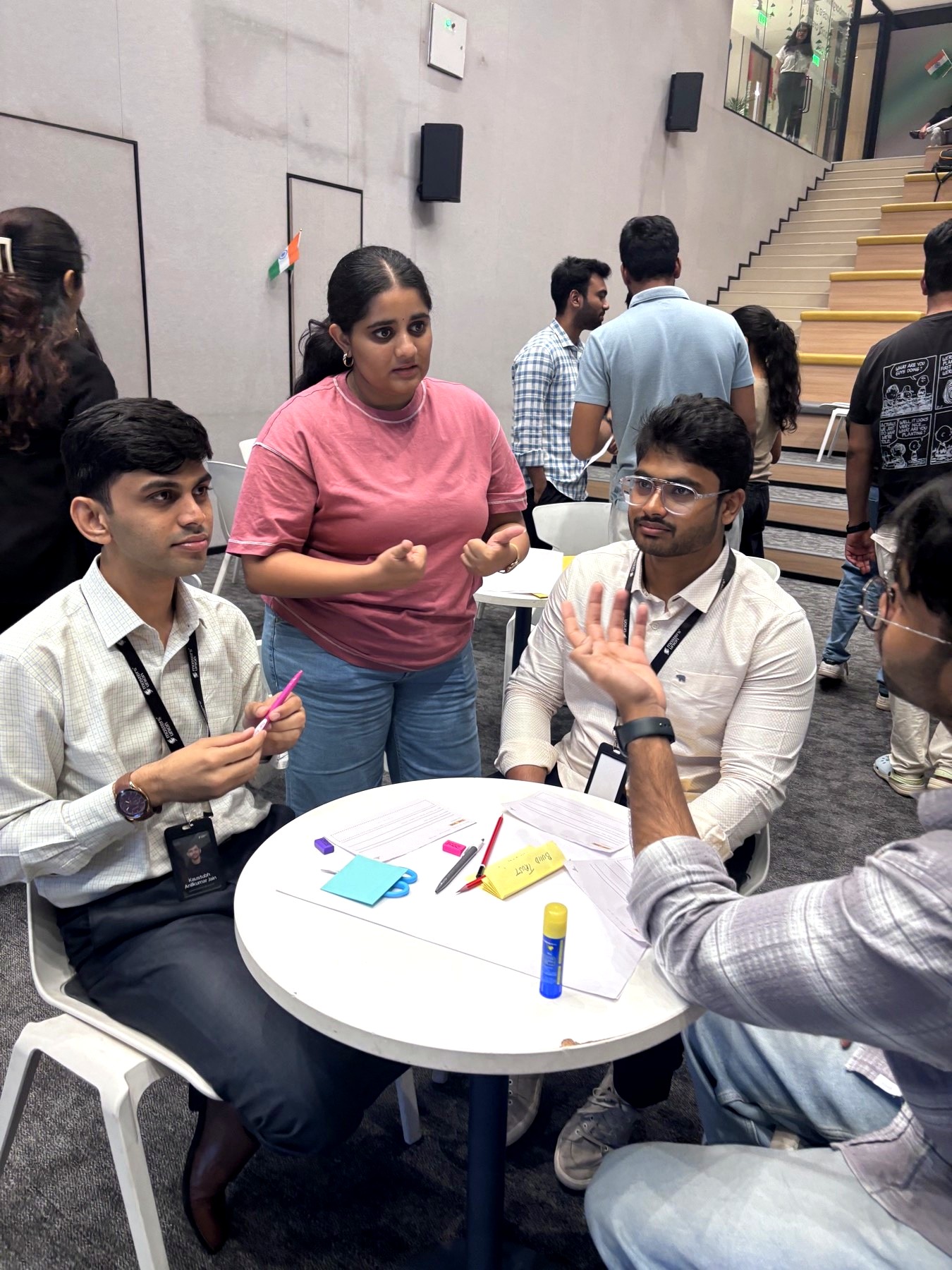A team deep in discussion around their 1995-tech worksheet