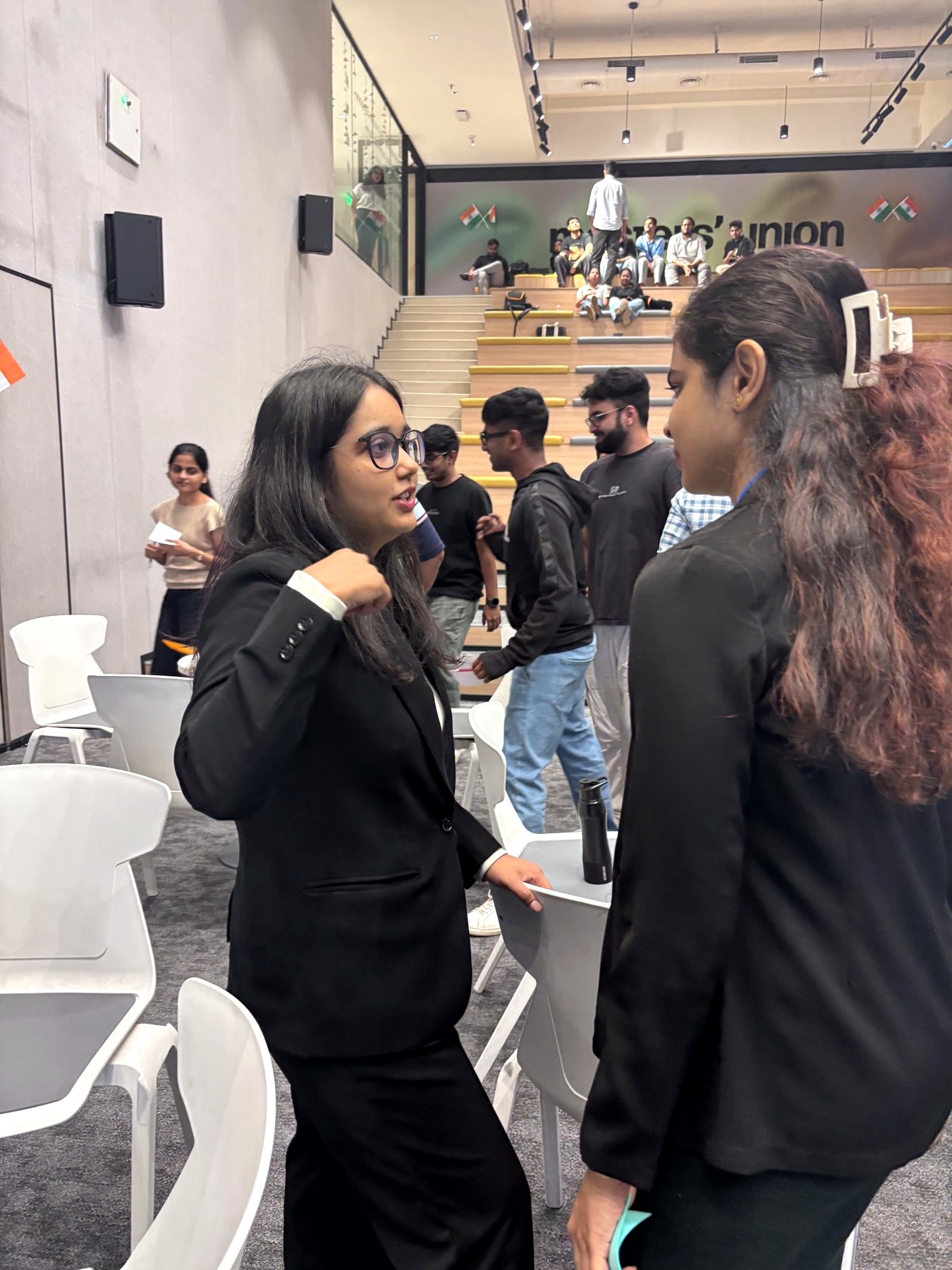 Team members huddled over their paper prototype